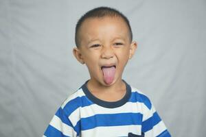 Happy boy taking pictures in the studio photo