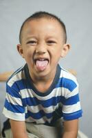 Happy boy in photo studio smile and laugh