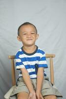 Happy boy in photo studio smile and laugh