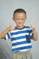 The boy laughed and smiled happily. photo