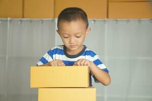 Boy practicing online sales Prepare to be a product model photo