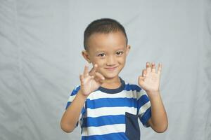 Happy boy taking pictures in the studio photo