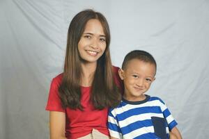 Mother and son playing together happily photo