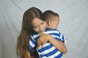 Mother and son playing together happily photo