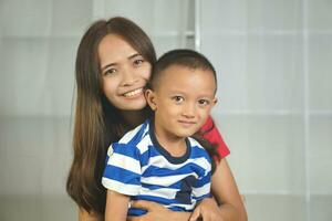 Mother and son playing together happily photo