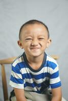 Happy boy in photo studio smile and laugh