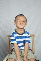 Happy boy in photo studio smile and laugh