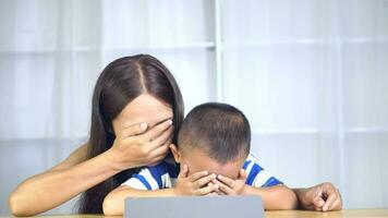 Mother and son watch a ghost movie Excited and afraid video