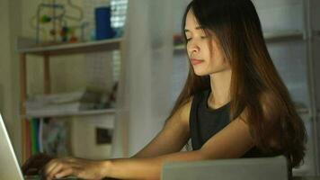 Woman working at home using a computer to communicate video