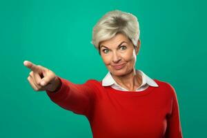 A photo of a middle aged woman pointing at empty space on a teal background, ai generative