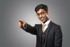 Photo of a happy indian businessman pointing at something looking like he is advertising or recommending a new commercial promotion, ai generative