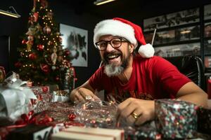 A photo of a happy designer with a beard and glasses sitting at a messy desk in an office wearing a santa hat and smiling at the camera, ai generative