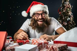 A photo of a happy designer with a beard and glasses sitting at a messy desk in an office wearing a santa hat and smiling at the camera, ai generative