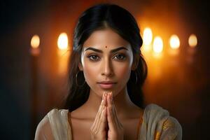 A photo of a beautiful indian woman with her hands folded in prayer in front of the camera, ai generative