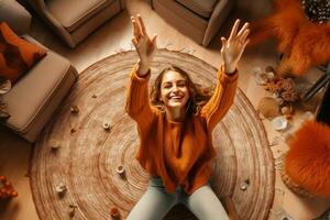 A picture of a young woman sitting on the carpet at home surrounded by autumn decorations making a victory sign with her fingers, ai generative photo