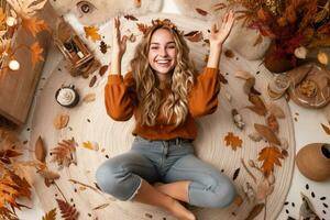 A picture of a young woman sitting on the carpet at home surrounded by autumn decorations making a victory sign with her fingers, ai generative photo