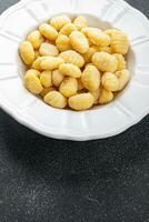 gnocchi raw food potato snack meal food on the table copy space food background rustic top view photo