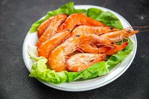 Gambas prawn fresh shrimp seafood crustacean langoustine meal food snack on the table copy space food background rustic top view photo