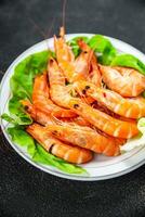 Gambas prawn fresh shrimp seafood crustacean langoustine meal food snack on the table copy space food background rustic top view photo