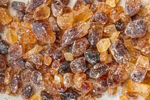 rock sugar crystals pieces candy brown sugar candied big rock caramel taste cane sugar healthy eating cooking appetizer meal food snack on the table photo