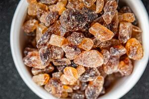 rock sugar crystals pieces candy brown sugar candied big rock caramel taste cane sugar healthy eating cooking appetizer meal food snack on the table photo