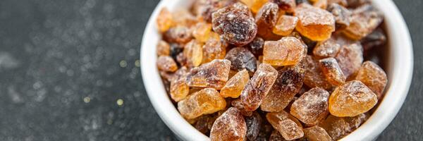 rock sugar crystals pieces candy brown sugar candied big rock caramel taste cane sugar healthy eating cooking appetizer meal food snack on the table photo