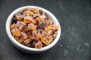 rock sugar crystals pieces candy brown sugar candied big rock caramel taste cane sugar healthy eating cooking appetizer meal food snack on the table photo