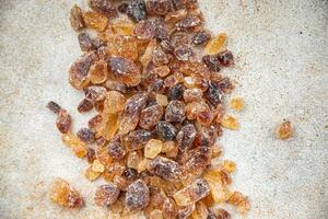 rock sugar crystals pieces candy brown sugar candied big rock caramel taste cane sugar healthy eating cooking appetizer meal food snack on the table photo