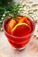 mulled wine christmas cocktail citrus and rosemary traditional drink new year holiday appetizer meal food on the table copy space food background rustic top view photo