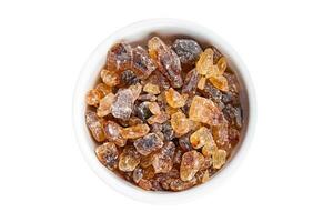 cane sugar rock sugar crystals pieces candy brown sugar candied sugar big rock caramel eating appetizer meal food snack on the table copy space food background rustic top view photo