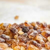 cane sugar crystal rock pieces candy brown sugar candied big rock caramel crystals sugar  taste eating cooking appetizer meal food snack on the table copy space food background rustic top view photo