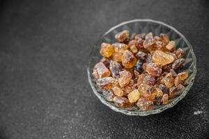 cane sugar crystal rock pieces candy brown sugar candied big rock caramel crystals sugar  taste eating cooking appetizer meal food snack on the table copy space food background rustic top view photo