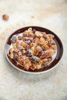 cane sugar crystal rock pieces candy brown sugar candied big rock caramel crystals sugar  taste eating cooking appetizer meal food snack on the table copy space food background rustic top view photo