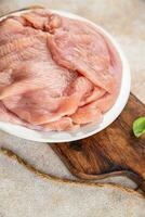 raw turkey fillet fresh poultry meat slice diet healthy eating cooking appetizer meal food snack on the table copy space food background rustic top view photo