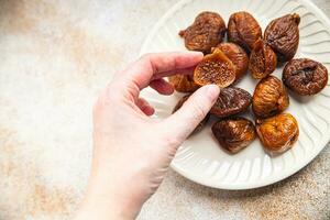 figs dried fruit smoked delicious healthy eating cooking appetizer meal food snack on the table copy space food background photo