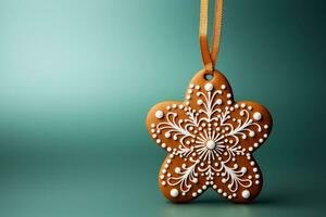 Eco friendly edible gingerbread ornament isolated on a gradient Christmas themed background photo