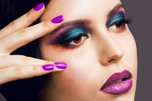 Close up fashion beauty portrait of elegant glamour lady with smoky eyes , full purple lips. photo