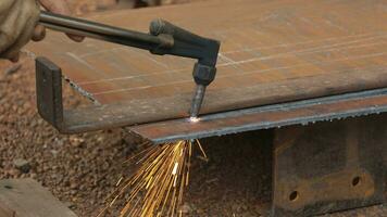 The hands of a mechanic are using a steel cutting tool. video