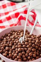 sweet crunchy chocolate children's breakfast chocolate balls on a white background photo