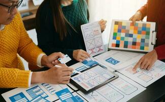 UX graphic designer planning application process development prototype wireframe for web smart phone. Creative digital development agency. photo