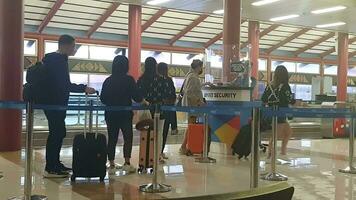 Jakarta, Indonesia on May 8 2023. Men and women lining up to have their passports and plane tickets checked at Soekartno Hatta Airport terminal 2F. video