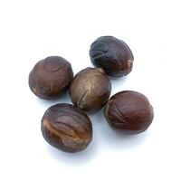 Five Whole Nutmeg isolated On White Background. Square Orientation photo