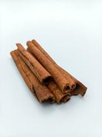 Cinnamon Sticks Isolated On White Background. Potrait Orientation photo