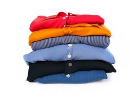 pile of different clothes, on white isolated background. photo