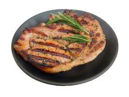 grilled pork with rosemary on white background photo