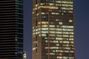 Business office windows at night Corporate building Ho Chi Minh City Vietnam photo