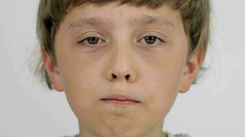 a young boy with a serious expression on his face video