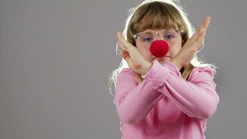 a little girl wearing glasses and a red nose video