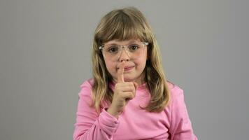 a little girl in glasses pointing at something video