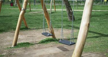 Closeup of a baby swing in the playground video